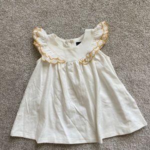 Short flutter sleeve cream top